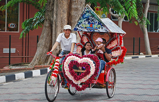 Trishaw driver and fare, Melaka